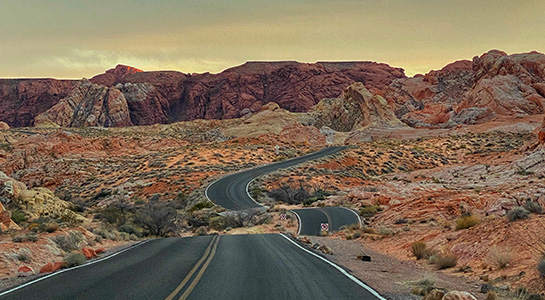 Road View Overlooking A Valley Of Rock Formations