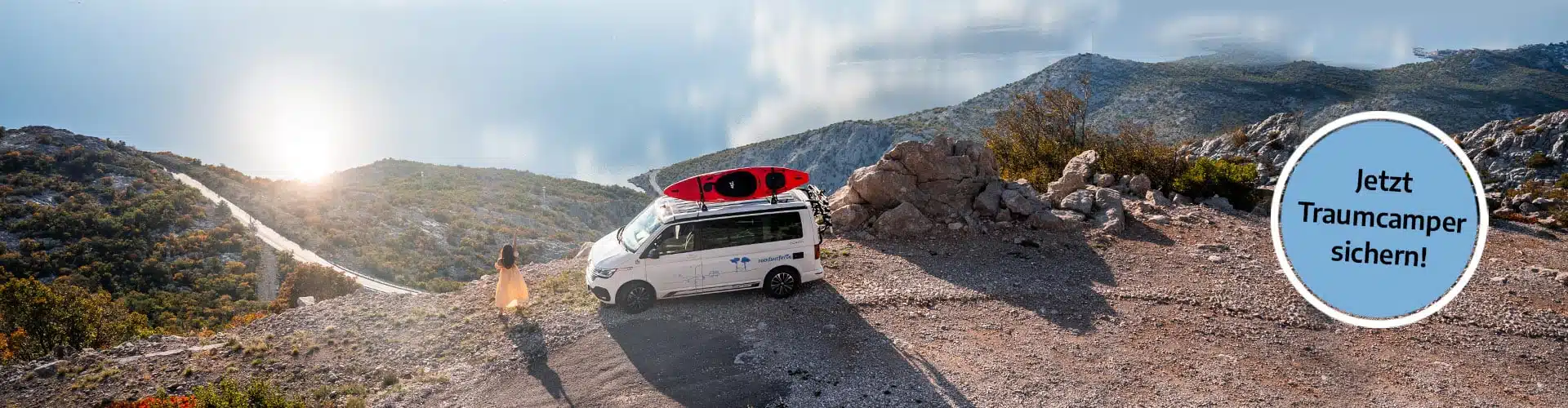 white vw california camper at a lookout point