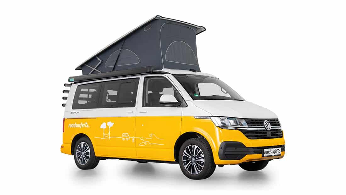 roadsurfer campervan beach hostel in yellow with pop up roof from the side view