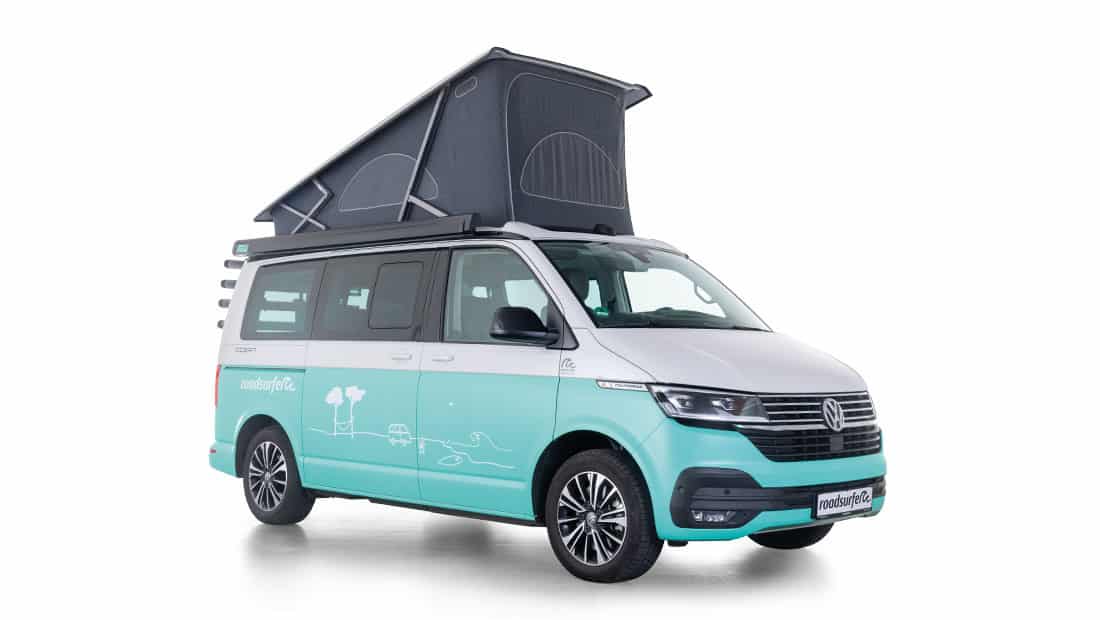 vw california ocean as roadsurfer campervan surfer suite in blue with pop up roof from the sideview