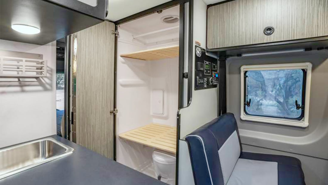 roadsurfer Horizon Hopper offrRoad RV inside view at the sitting area an the bathroom