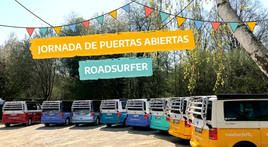 Colourfull vans from roadsurfer parked in a row at the open door days in Spain