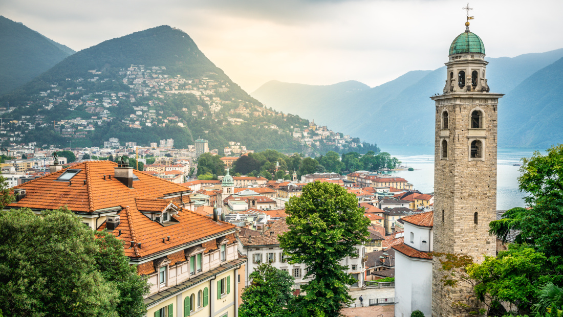 Scenic cityscape of Lugano with Cathedral of Saint Lawrence bell