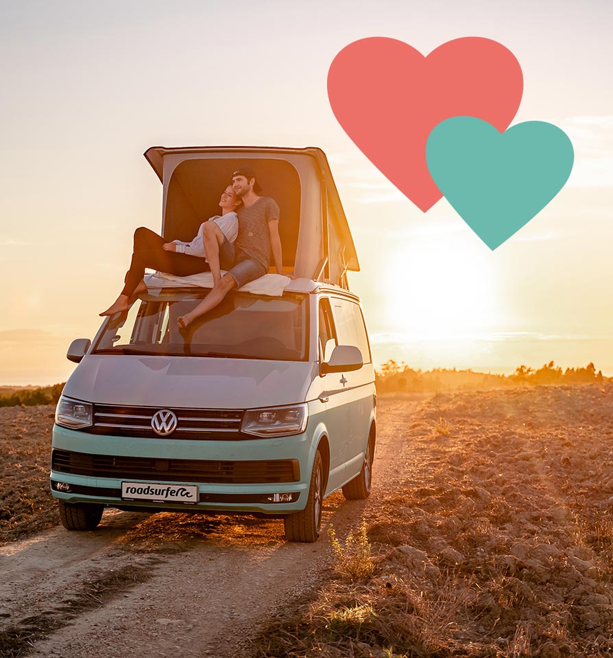 Romantic Couple sitting on a roadsurfer Campervan