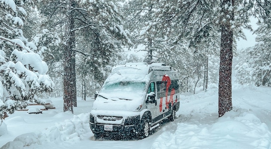 RV parked in the snow in a California National Park