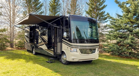 Class A RV parked outdoors as an example of the main RV classes