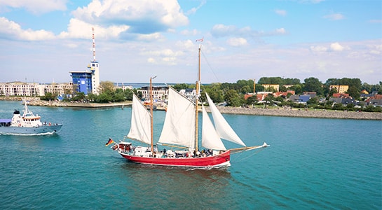 Red sailboat on the baltic sea.