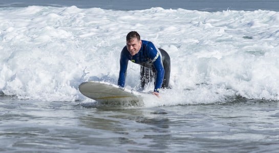 Surfer riding a clean wave at Sand Dollar Beach on California’s Big Su