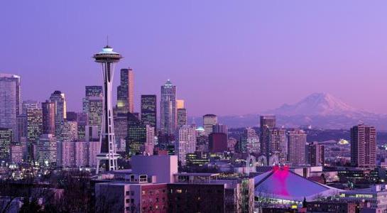 Seattle skyline with Space Needle and Mount Rainier at sunset on a Seattle to San Francisco road trip