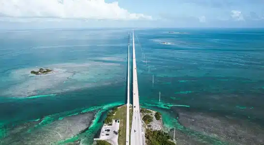 Aerial view of the Seven Mile Bridge stretching across turquoise waters in Marathon, Florida Keys.