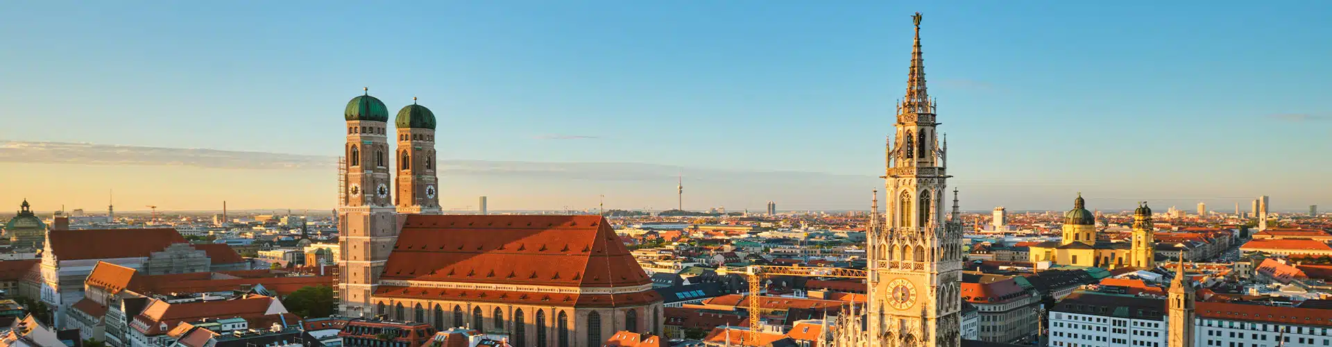 Picture showing the Frauenkirche and the new city hall in Munich, as well as the rest of the Munich skyline.