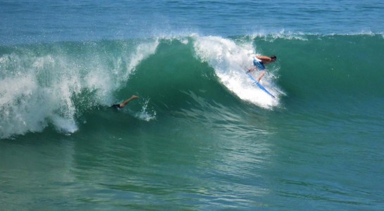 Surfer carving across a strong wave at Trestles in San Clemente