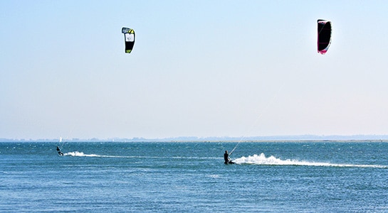 Two kitesurfers in the baltic sea.