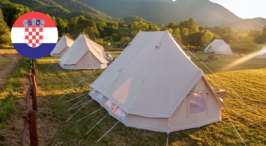 Large camping tents on a unique camping spot in croatia at sunset