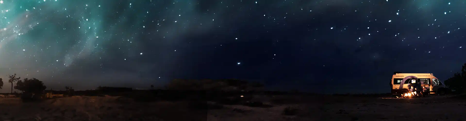 Van parked under starry sky