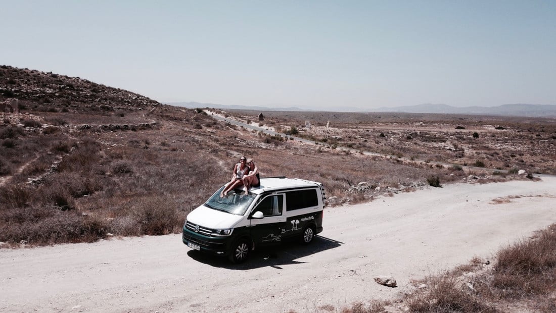 van driving on a dusty road in Spain