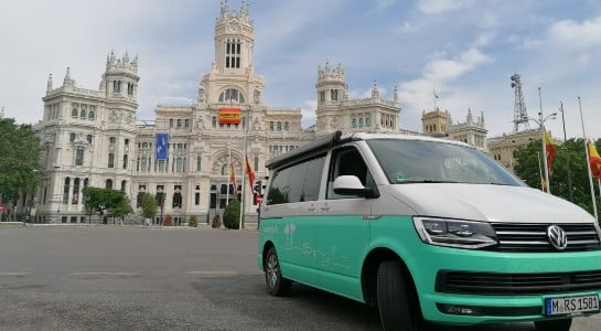 Turquoise VW California in front of Madrid City Hall