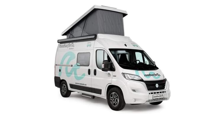 White Weinsberg CaraTour 540d from roadsurfer partial front/side view