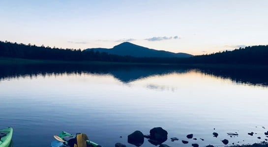 Peaceful sunset over Kaibab Lake in Williams, Arizona, a scenic stop on an Arizona road trip