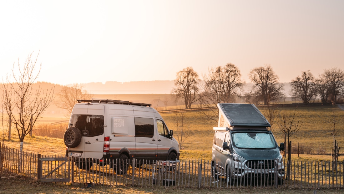morning, two vans on a field