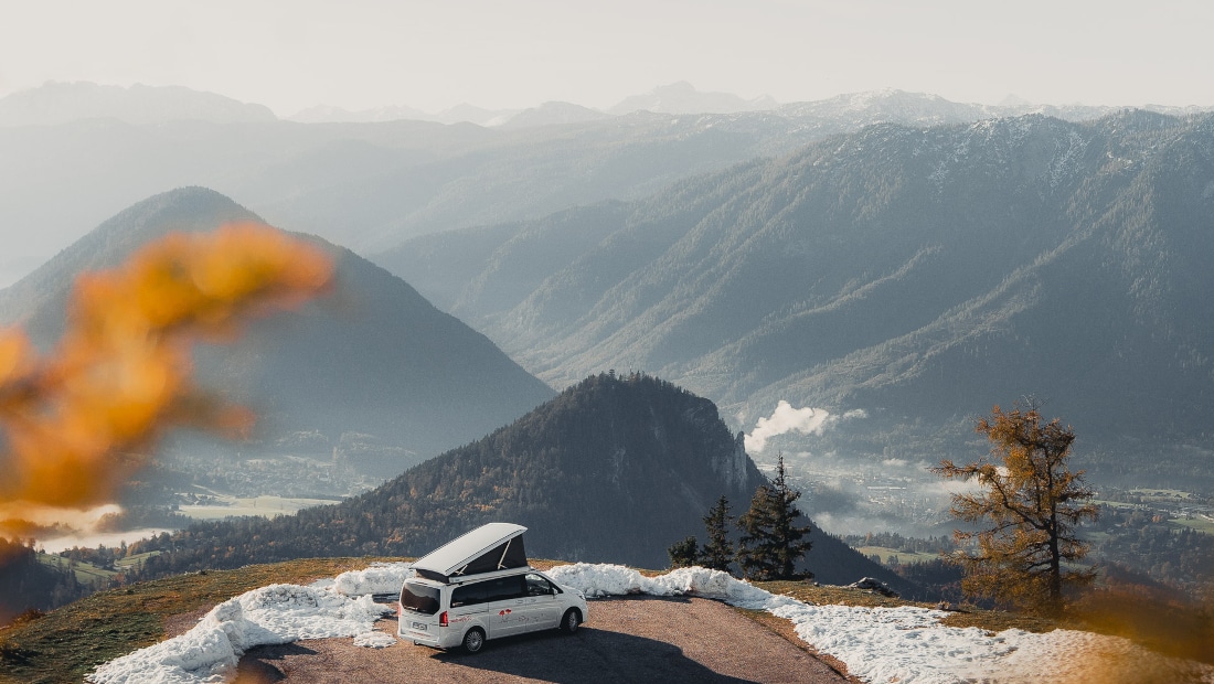 white van on a plateau in the mountains