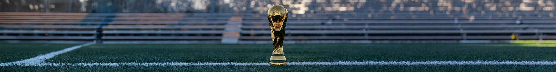 World Soccer Tournament trophy on a soccer field.
